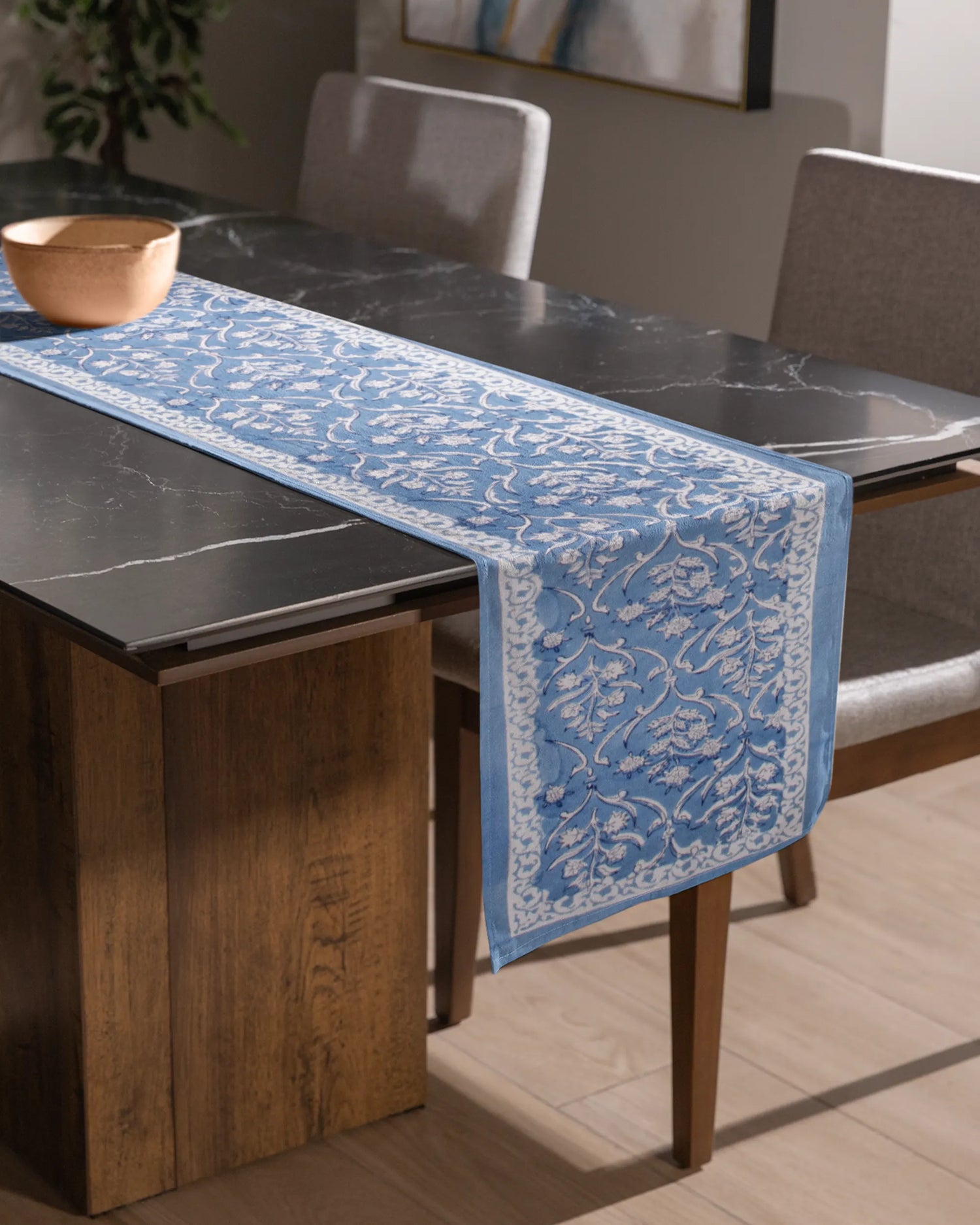 A beautiful blue color table runner, with an elegant white patterns. An essential table accessory that adds charm your home decor effortlessly.