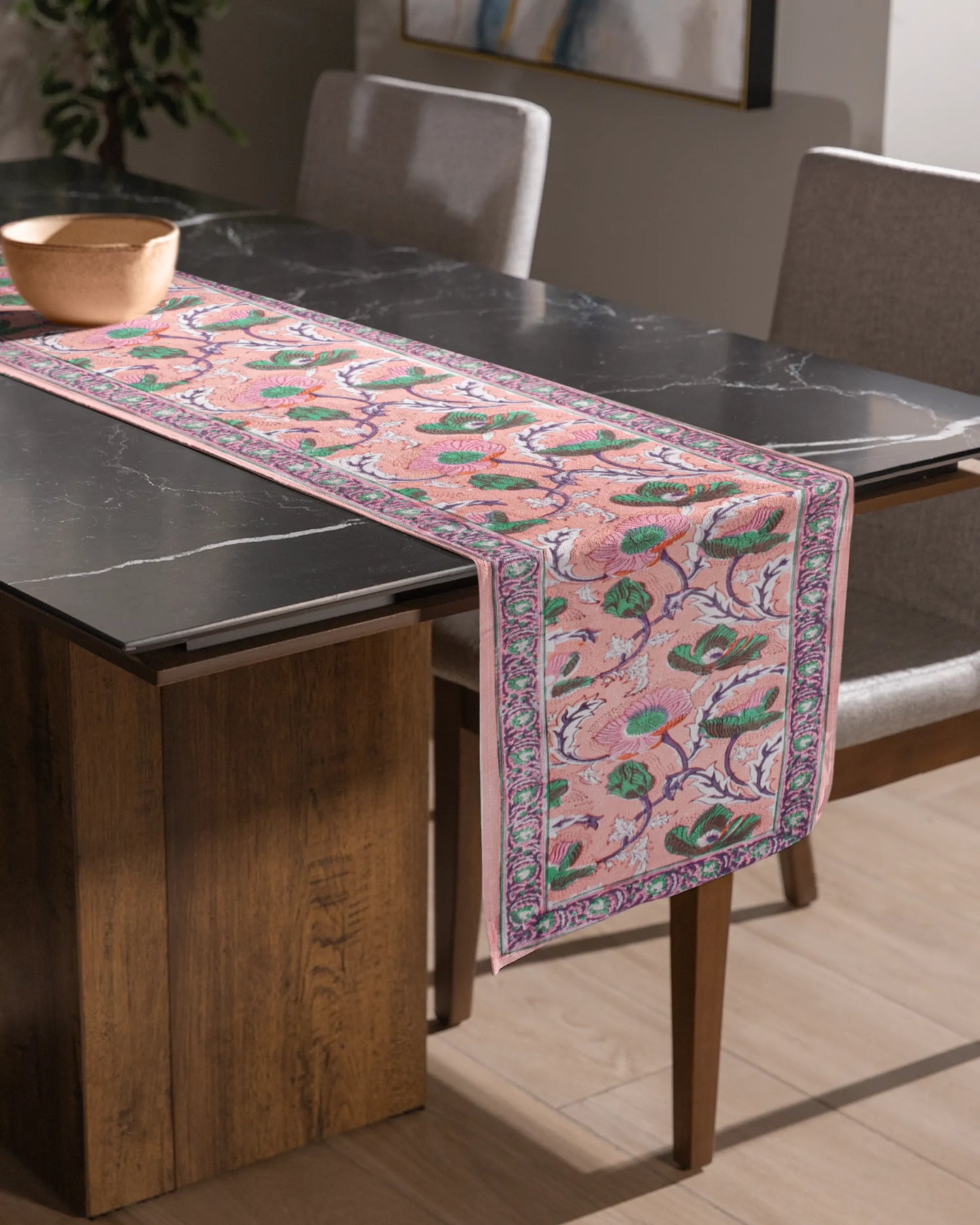 A beautiful pink color table runner, with an elegant green floral patterns. An essential table accessory that adds charm your home decor effortlessly.